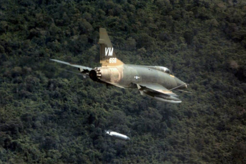 United States F-100D Super Sabre aircraft dropping Napalm near Bien Hoa, Vietnam.