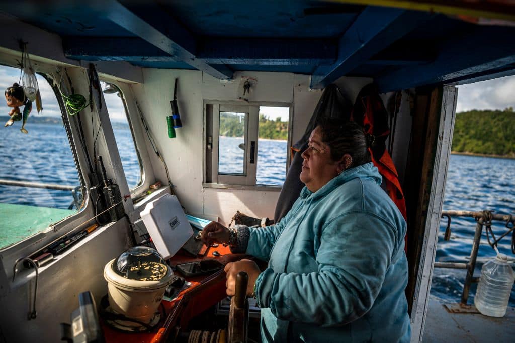 Carmen in her artisanal fishing vessel “Albatros”.