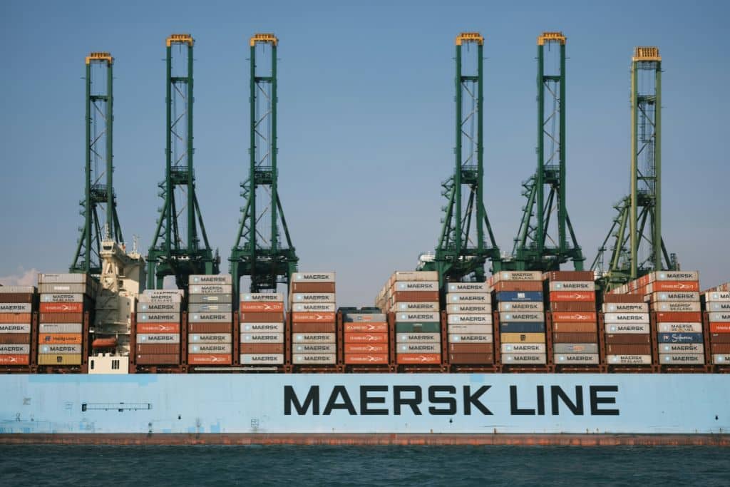 A Maersk cargo ship on a body of water.